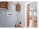 Functional laundry room with overhead cabinets and utility connections at 4047 Mistletoe Dr, Burlington, NC 27217