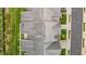 Overhead shot of a house roof, highlighting its design and structure, along with the surrounding green lawn at 4105 Gilchrist Dr, Burlington, NC 27215