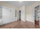 Bedroom featuring tiled flooring, built-in wardrobe, closet and ensuite door at 4105 Gilchrist Dr, Burlington, NC 27215