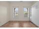 Bedroom featuring 2 windows, tiled flooring, and built-in wardrobe at 4105 Gilchrist Dr, Burlington, NC 27215