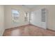 Bedroom featuring 2 windows, tiled flooring, and built-in wardrobe at 4105 Gilchrist Dr, Burlington, NC 27215