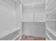 View of walk-in closet featuring built-in shelving and tiled floor at 4105 Gilchrist Dr, Burlington, NC 27215