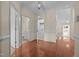 Bright entryway with hardwood floors and views of the bathroom, laundry room, and living spaces at 4105 Gilchrist Dr, Burlington, NC 27215