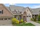Aerial view of a brick home with a well-manicured lawn, showcasing its curb appeal at 4105 Gilchrist Dr, Burlington, NC 27215
