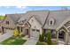 Aerial view of a brick home with a well-manicured lawn, showcasing its curb appeal at 4105 Gilchrist Dr, Burlington, NC 27215