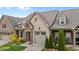 Aerial view of a brick home with a well-manicured lawn, showcasing its curb appeal at 4105 Gilchrist Dr, Burlington, NC 27215