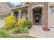 Charming front entrance with stone archway, brick accents, and well-manicured landscaping at 4105 Gilchrist Dr, Burlington, NC 27215