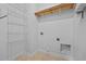 Spacious laundry area with shelving and washer-dryer hookups at 4105 Gilchrist Dr, Burlington, NC 27215