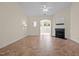 Bright living room with tile floors, fireplace, ceiling fan, and natural light at 4105 Gilchrist Dr, Burlington, NC 27215