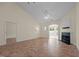 Bright living room featuring a fireplace and tile flooring, leading to an outdoor patio at 4105 Gilchrist Dr, Burlington, NC 27215