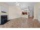 Open living room with a fireplace and access to a modern kitchen with dark wood cabinetry at 4105 Gilchrist Dr, Burlington, NC 27215
