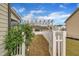 Fenced backyard featuring a covered pergola and well-maintained landscaping at 412 Airedale Trl, Garner, NC 27529