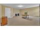 Spacious finished basement, neutral walls, plush carpet, and ample room for activities at 412 Airedale Trl, Garner, NC 27529