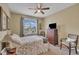 Neutral bedroom with a large window, carpet floors, and a ceiling fan at 412 Airedale Trl, Garner, NC 27529