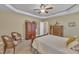 This bedroom features carpet floors, a ceiling fan, and an ensuite bathroom at 412 Airedale Trl, Garner, NC 27529