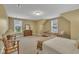 Spacious bedroom with a comfortable bed, natural light, and plush carpeting at 412 Airedale Trl, Garner, NC 27529