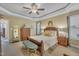 This primary bedroom features carpet floors, neutral paint, ceiling fan, and natural light at 412 Airedale Trl, Garner, NC 27529