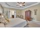 This bedroom features carpet floors, a ceiling fan, and an ensuite bathroom at 412 Airedale Trl, Garner, NC 27529