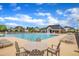 Expansive community pool with lounge chairs, tables, and a fountain for summer enjoyment at 412 Airedale Trl, Garner, NC 27529