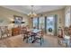 Bright dining room with natural light, chandelier, and space for a large table and buffet at 412 Airedale Trl, Garner, NC 27529