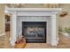 Elegant fireplace design with stone tiles and a decorative mantel at 412 Airedale Trl, Garner, NC 27529