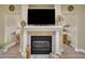 Close-up of the fireplace with white mantle, offering a cozy focal point in the living space at 412 Airedale Trl, Garner, NC 27529