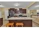 Kitchen with granite counters, stainless steel appliances, and central island seating at 412 Airedale Trl, Garner, NC 27529
