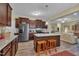 Updated kitchen with granite counters, stainless appliances, and island seating area at 412 Airedale Trl, Garner, NC 27529