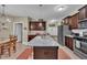 Open kitchen showcases granite countertops, stainless appliances, and wooden cabinets at 412 Airedale Trl, Garner, NC 27529