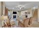 Spacious living room boasts a fireplace, staircase, and seamless flow to the adjacent kitchen at 412 Airedale Trl, Garner, NC 27529