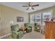 Cozy living room with natural light, neutral walls, and comfortable green chairs at 412 Airedale Trl, Garner, NC 27529