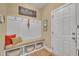 Functional mudroom with built-in bench seating, storage baskets, and convenient hooks at 412 Airedale Trl, Garner, NC 27529