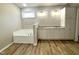 Bathroom showcasing a built-in bathtub and a vanity with granite countertops at 437 Earnest Way, Kenly, NC 27542