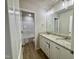 The bathroom features a double vanity with granite countertops and modern fixtures at 437 Earnest Way, Kenly, NC 27542
