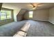 Spacious carpeted bedroom with plenty of sunlight from double windows and a ceiling fan at 437 Earnest Way, Kenly, NC 27542