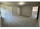 A spacious bedroom with neutral carpet and a simple, clean design at 437 Earnest Way, Kenly, NC 27542