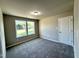 Bedroom with a view from the double windows and a closet at 437 Earnest Way, Kenly, NC 27542