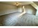 Spacious carpeted bedroom with plenty of sunlight and a ceiling fan at 437 Earnest Way, Kenly, NC 27542