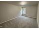 A cozy bedroom with a view of nature outside the window at 437 Earnest Way, Kenly, NC 27542