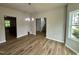 Bright dining room with wood floors, chandelier, and lots of natural light at 437 Earnest Way, Kenly, NC 27542