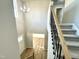 Entryway featuring a carpeted staircase and chandelier at 437 Earnest Way, Kenly, NC 27542