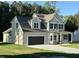 Charming two-story home with a two-car garage and landscaped yard at 437 Earnest Way, Kenly, NC 27542