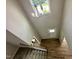 Bright foyer with a staircase and a view of the entrance with stylish chandelier at 437 Earnest Way, Kenly, NC 27542