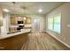 Bright kitchen featuring a granite island, wood cabinets, and stainless steel appliances at 437 Earnest Way, Kenly, NC 27542