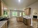 Spacious kitchen featuring granite countertops, stainless steel appliances, and ample cabinet space at 437 Earnest Way, Kenly, NC 27542