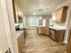 Spacious kitchen with stainless steel appliances, granite countertops, and wooden cabinets at 437 Earnest Way, Kenly, NC 27542