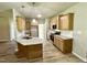 Spacious kitchen with an island, stainless steel appliances, granite countertops, and wooden cabinets at 437 Earnest Way, Kenly, NC 27542