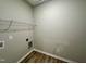 A functional laundry room with shelving and modern hookups for appliances at 437 Earnest Way, Kenly, NC 27542