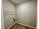 Functional laundry room with wire shelving and connection points at 437 Earnest Way, Kenly, NC 27542