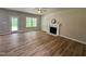 Inviting living room with a fireplace, ceiling fan, and a glass door to the exterior at 437 Earnest Way, Kenly, NC 27542